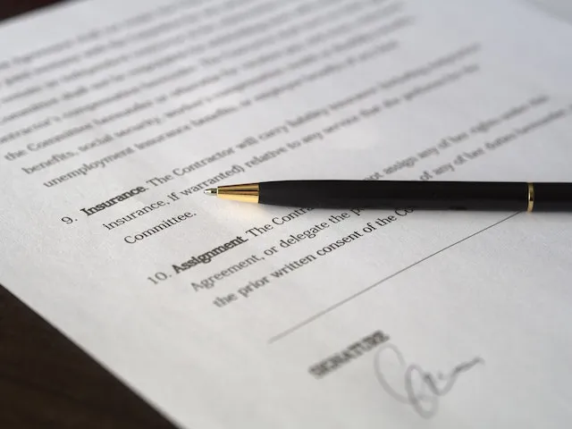 An Insurance Document with a Pen on Top