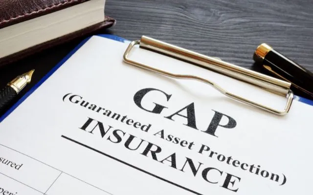 Gap Insurance Contract with a Pen on the Table