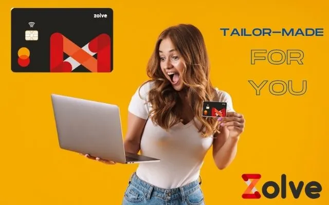 A Girl holding laptop in one hand and Zolve Credit Card in the other to use it